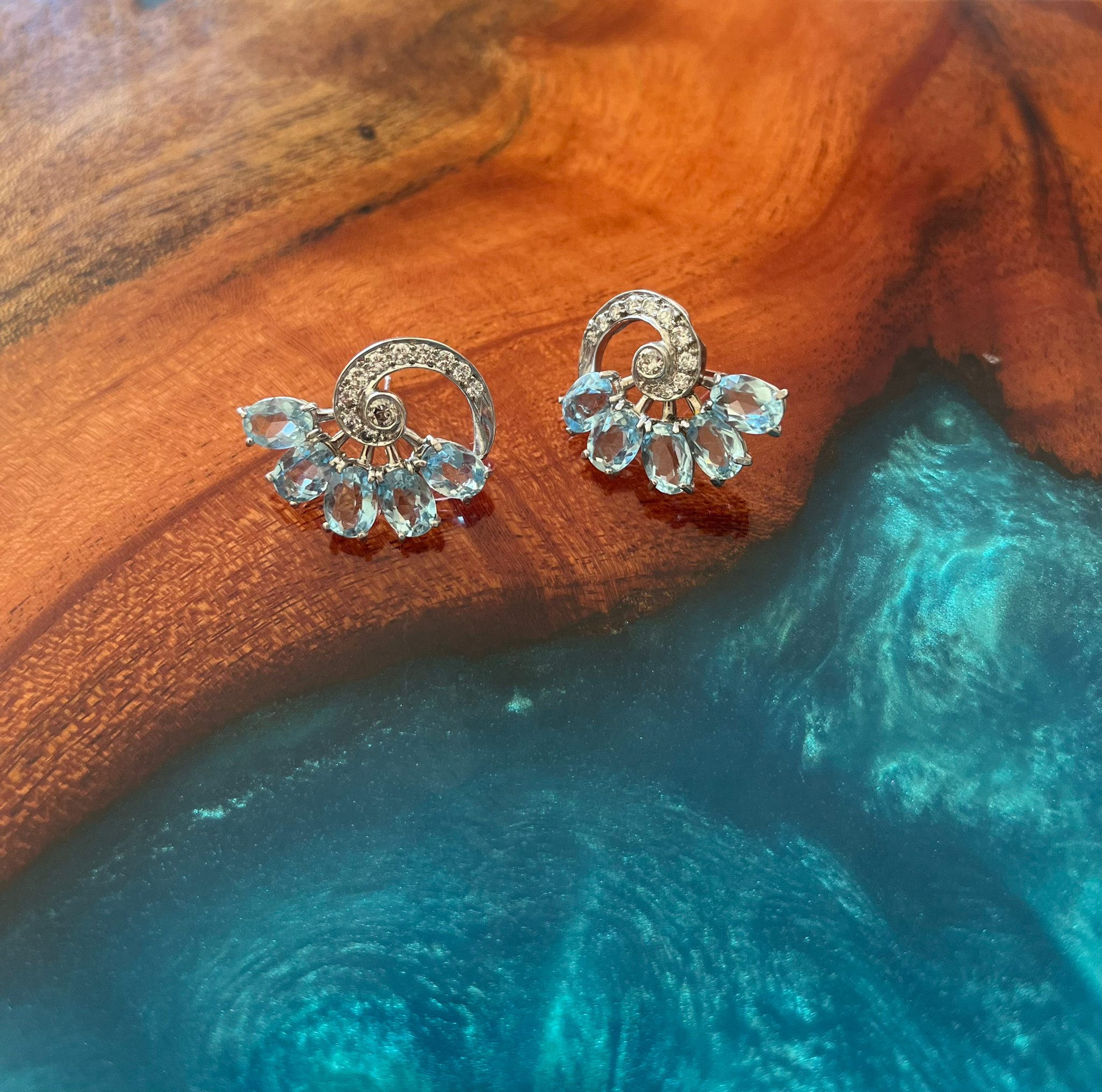 Art Deco Diamond and Aquamarine Platinum Earrings designed as a striking statement of architectural luxury.