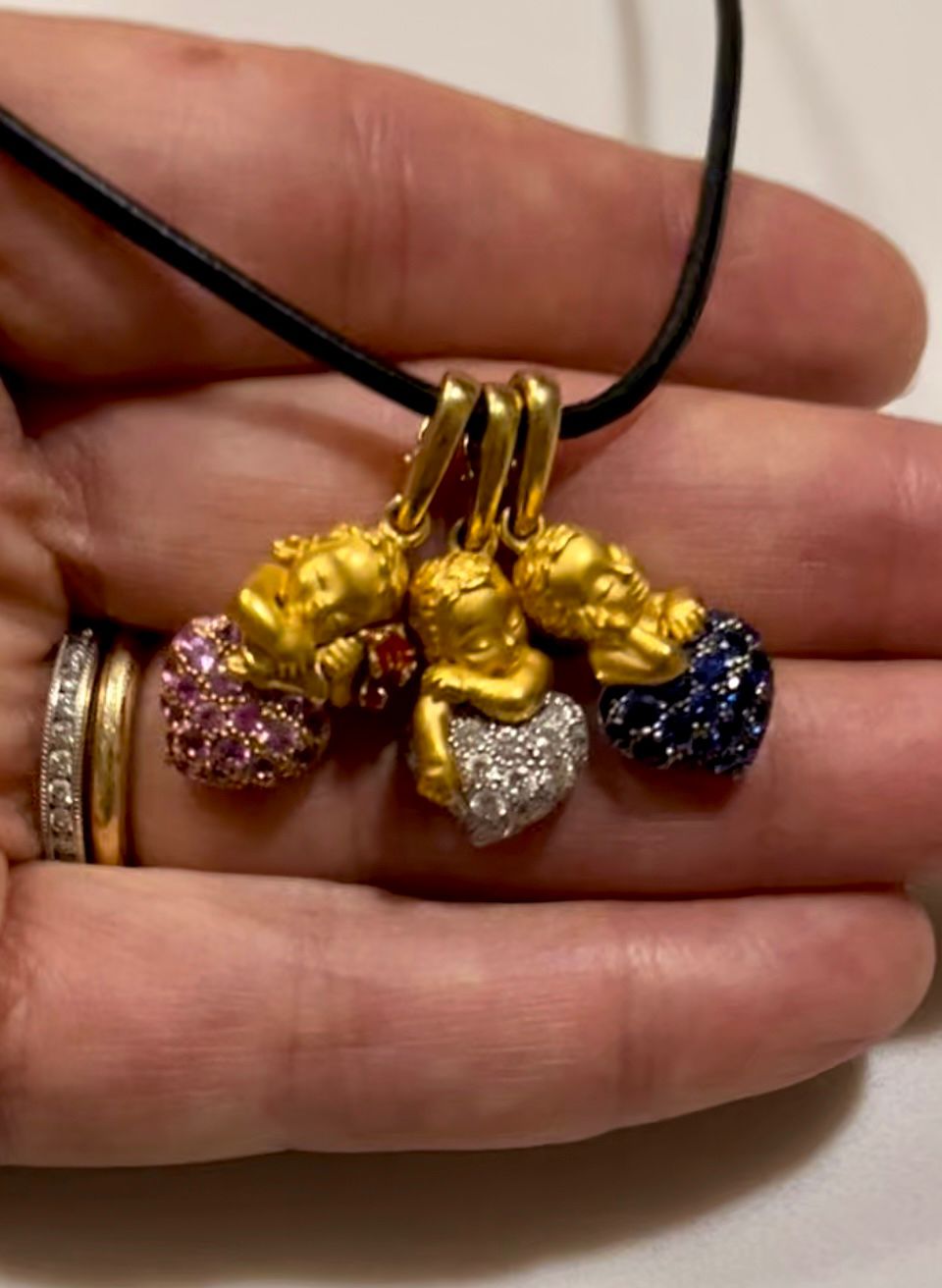 Italian handcrafted cupid pendant showcasing lab-grown diamonds and the artistry of Lab grown diamond Boca Raton.