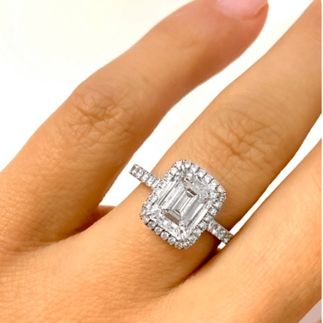 Emerald cut diamond ring with channel-set band inspired by Engagement Rings in Boca Raton.