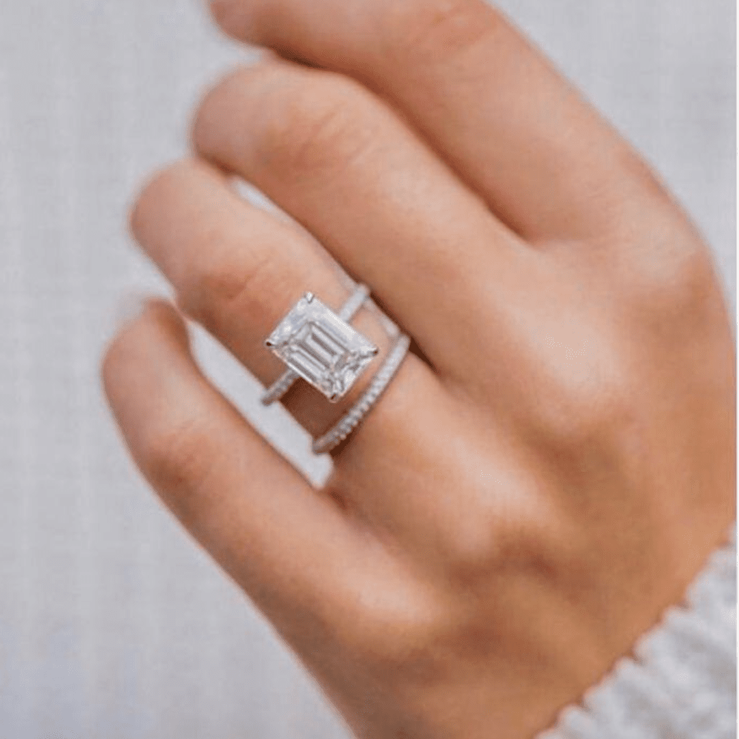 Architectural emerald cut engagement ring aligned with Engagement Rings in Boca Raton.
