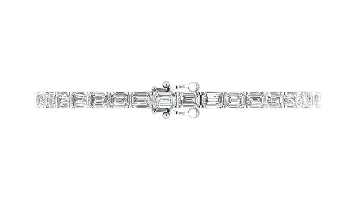 Modern emerald cut east west lab grown diamond bracelet styled alongside a diamond engagement ring in Boca Raton and a lab-grown diamond engagement ring in Boca Raton.