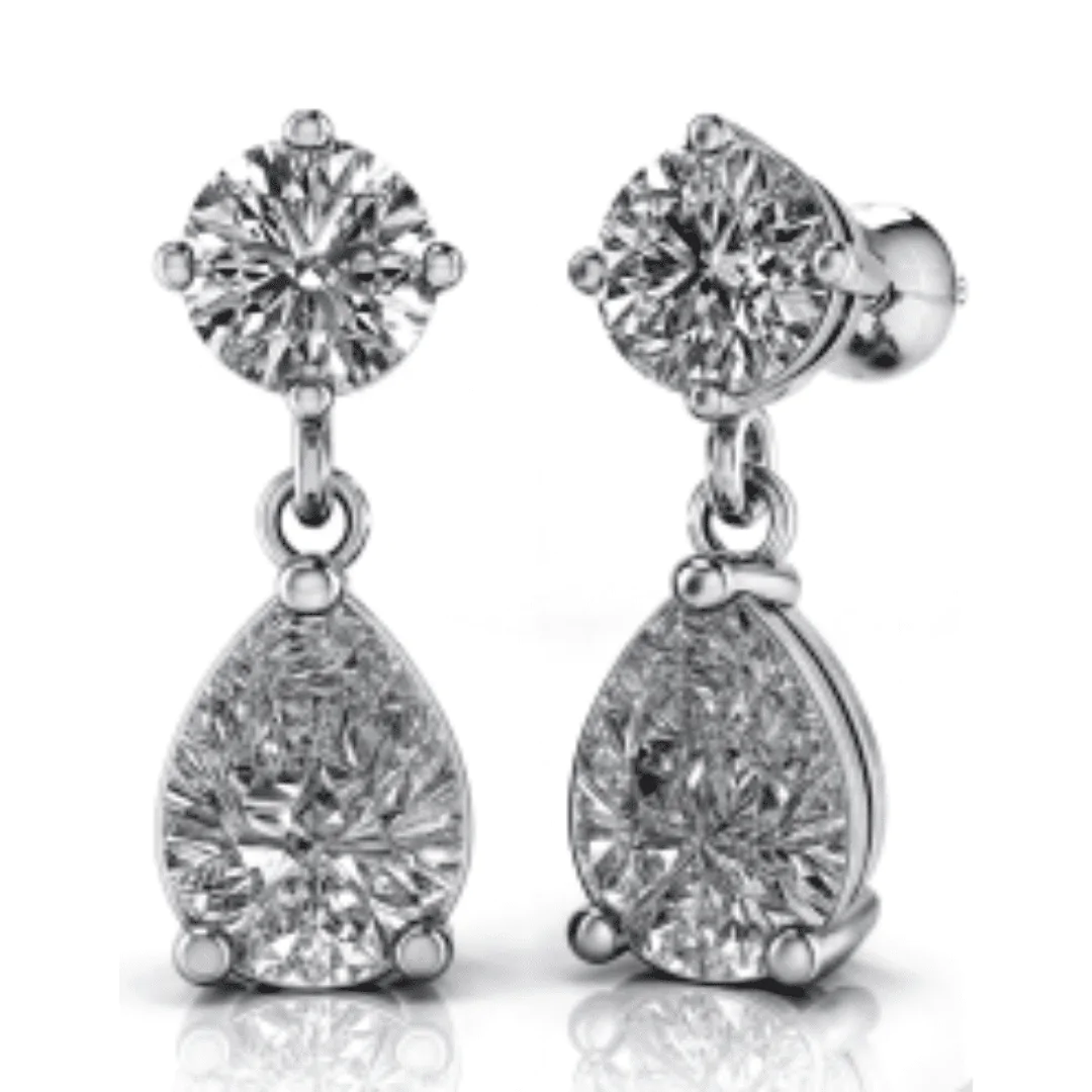 Pear drop lab-grown diamond earrings complementing a diamond engagement ring in Boca Raton and a lab-grown diamond engagement ring in Boca Raton.