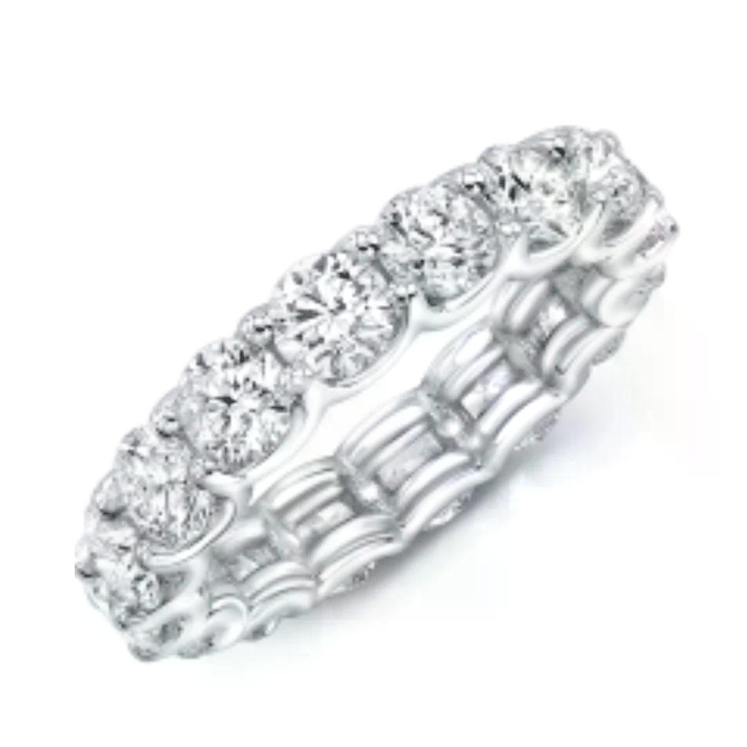 Round lab grown diamond eternity band designed to complement a diamond engagement ring in Boca Raton and a lab-grown diamond engagement ring in Boca Raton.