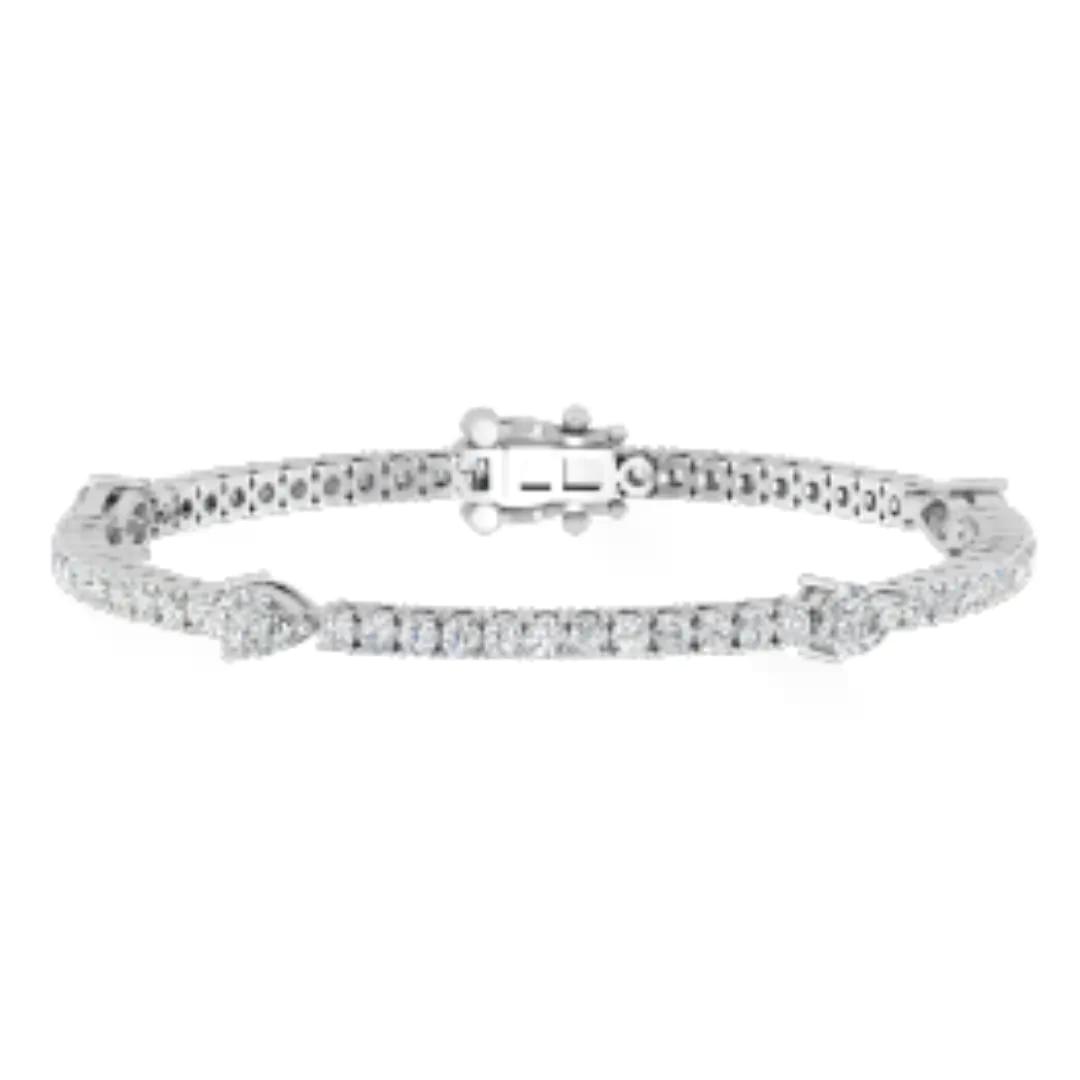 Round and pear lab grown diamond bracelet designed to complement a diamond engagement ring in Boca Raton and a lab-grown diamond engagement ring in Boca Raton.